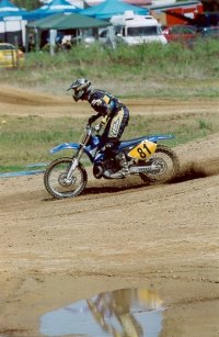 Photos of me racing my 2002 YZ 250 in 2003 over jump2